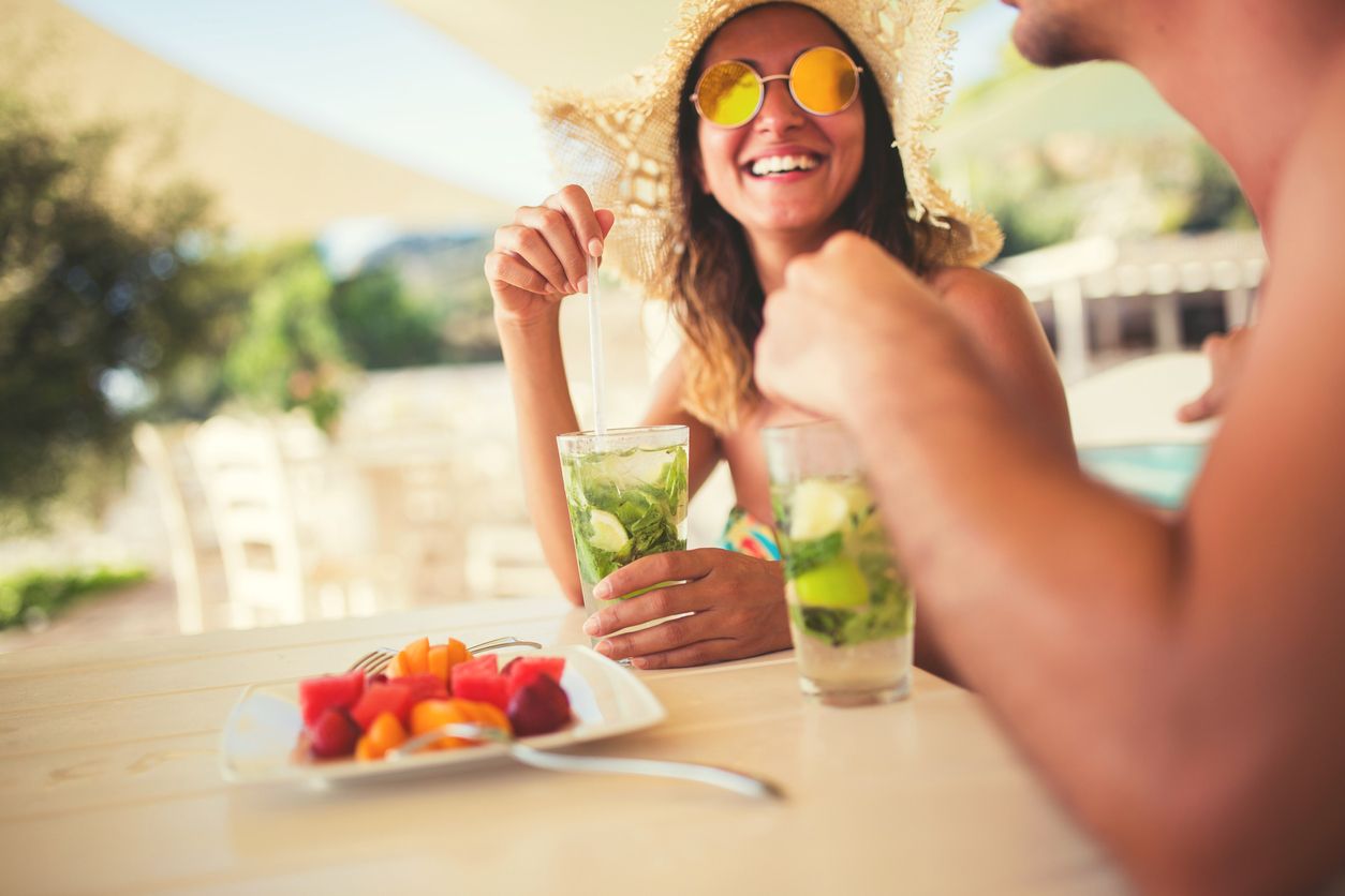 Couple Drinking Cocktails At Hotel