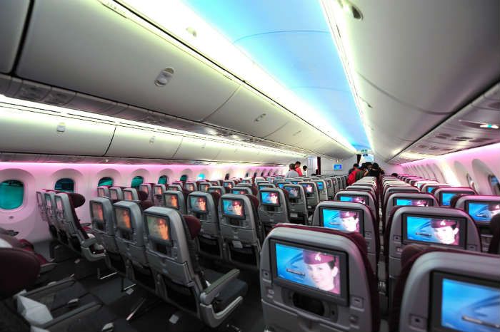 Plane interior with entertainment centres