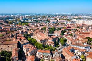An aerial city view of Toulouse in France on a clear day with the Basilica of Saint-Sernin in the centre