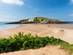 A view across the sand causeway of Burgh Island in Devon, UK