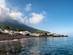 View of white houses beneath a steaming volcano on Stromboli island, Sicily