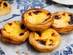 A close up of pastel de natas - traditional Portuguese custard tarts