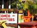 A close up, hand-blurred image of the outside tables and sign of Arawak Cay seafood restaurant on Nassau & Paradise Island