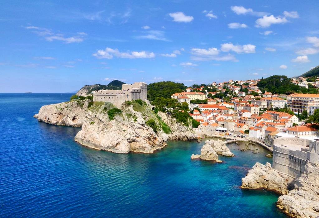 View of the craggy coastline of Dubrovnik with Fort Lovrijenac overlooking the sea and city