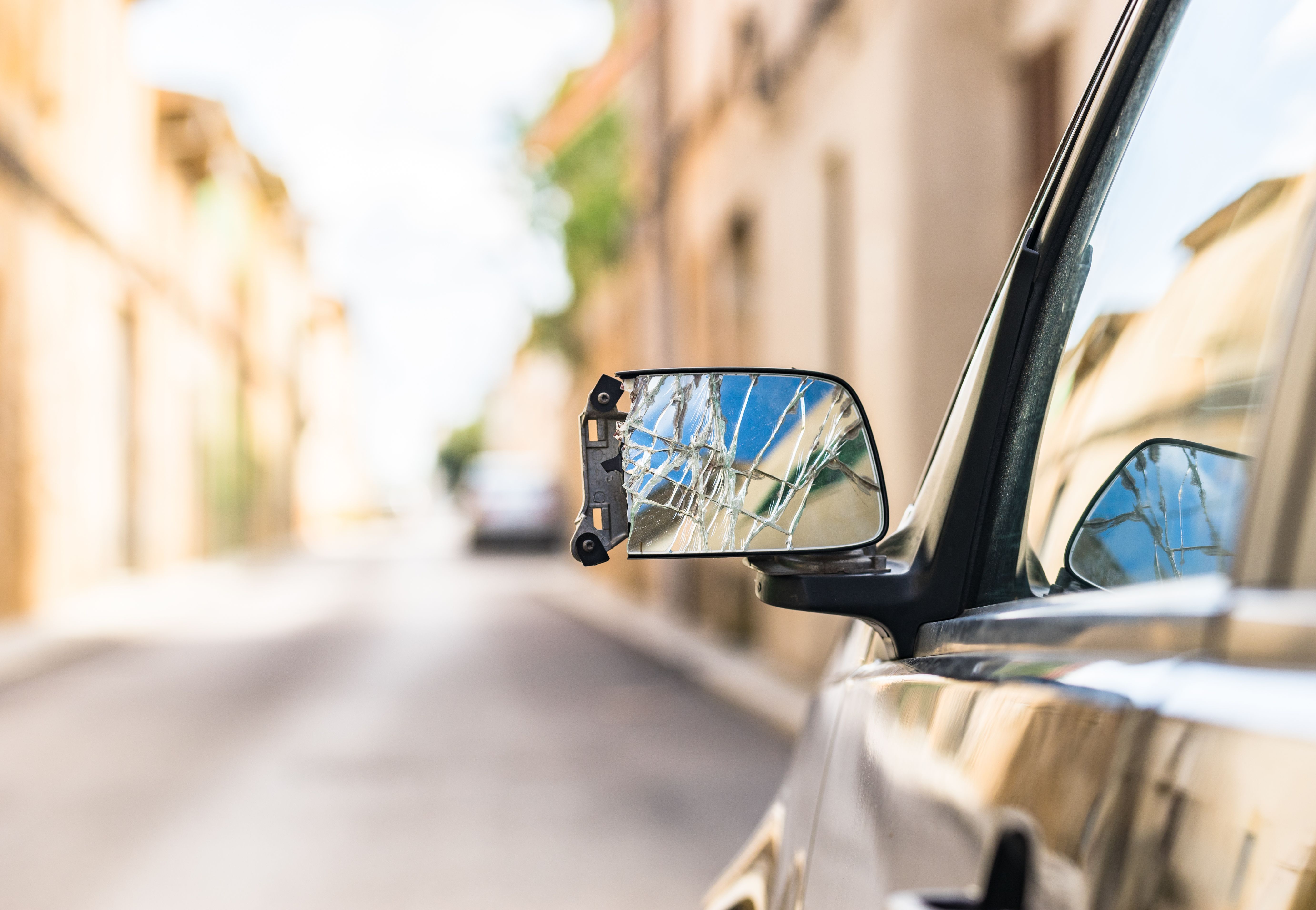 A close up shot of a broken car wing mirror after an accident
