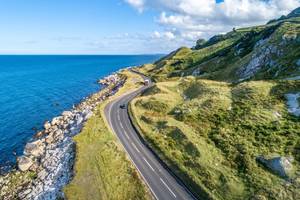 Aerial view of Northern Ireland's Causeway Coastal Route, which winds along the Antrim coast