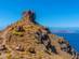 Stone stairs lead up to an old clifftop fort overlooking the blue Mediterranean