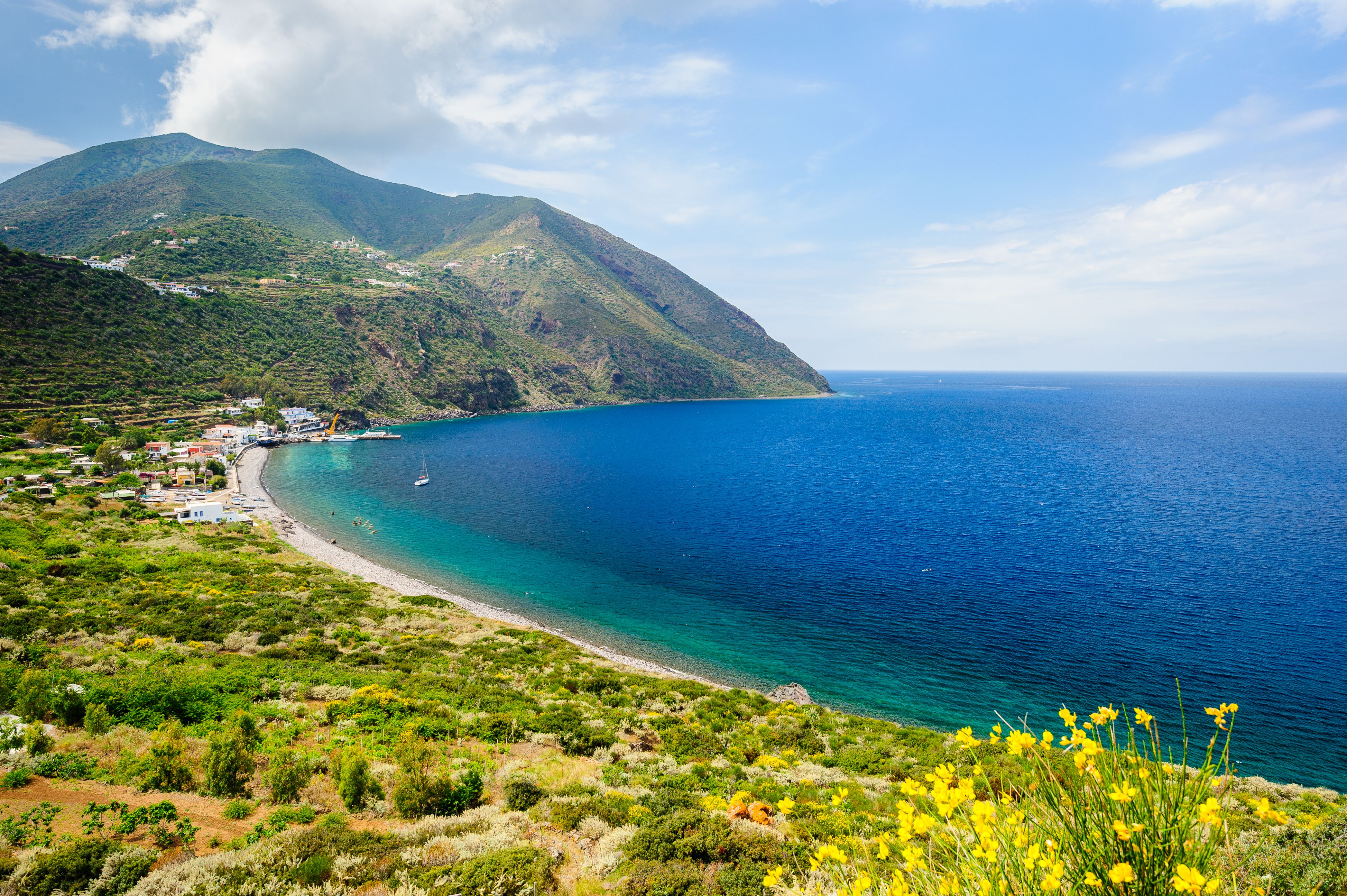 View of a large sweeping beach on Filicudi island in Sicily