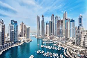 View of the skyscrapers and yachts of Dubai Marina on a sunny day