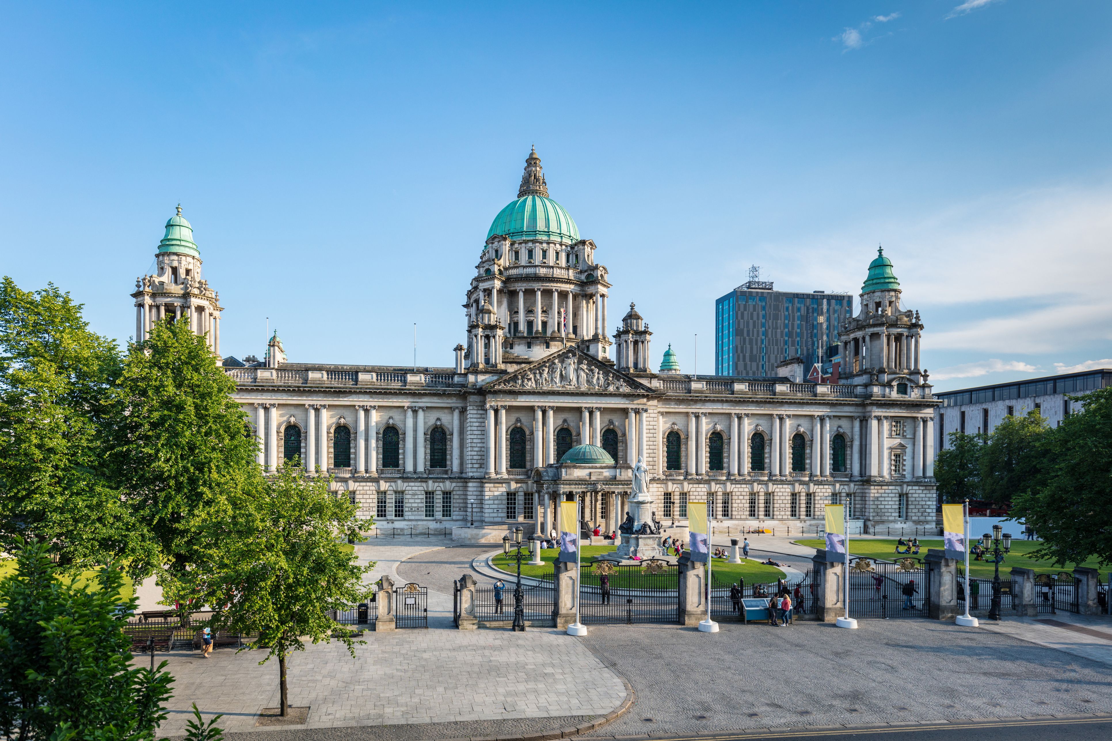 View of the Belfast City Hall in summer under sunny blue sky