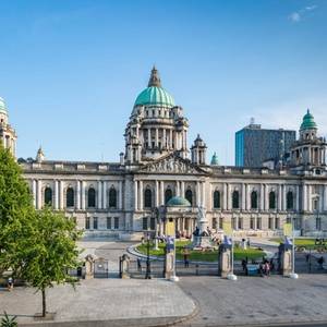 View of the Belfast City Hall in summer under sunny blue sky