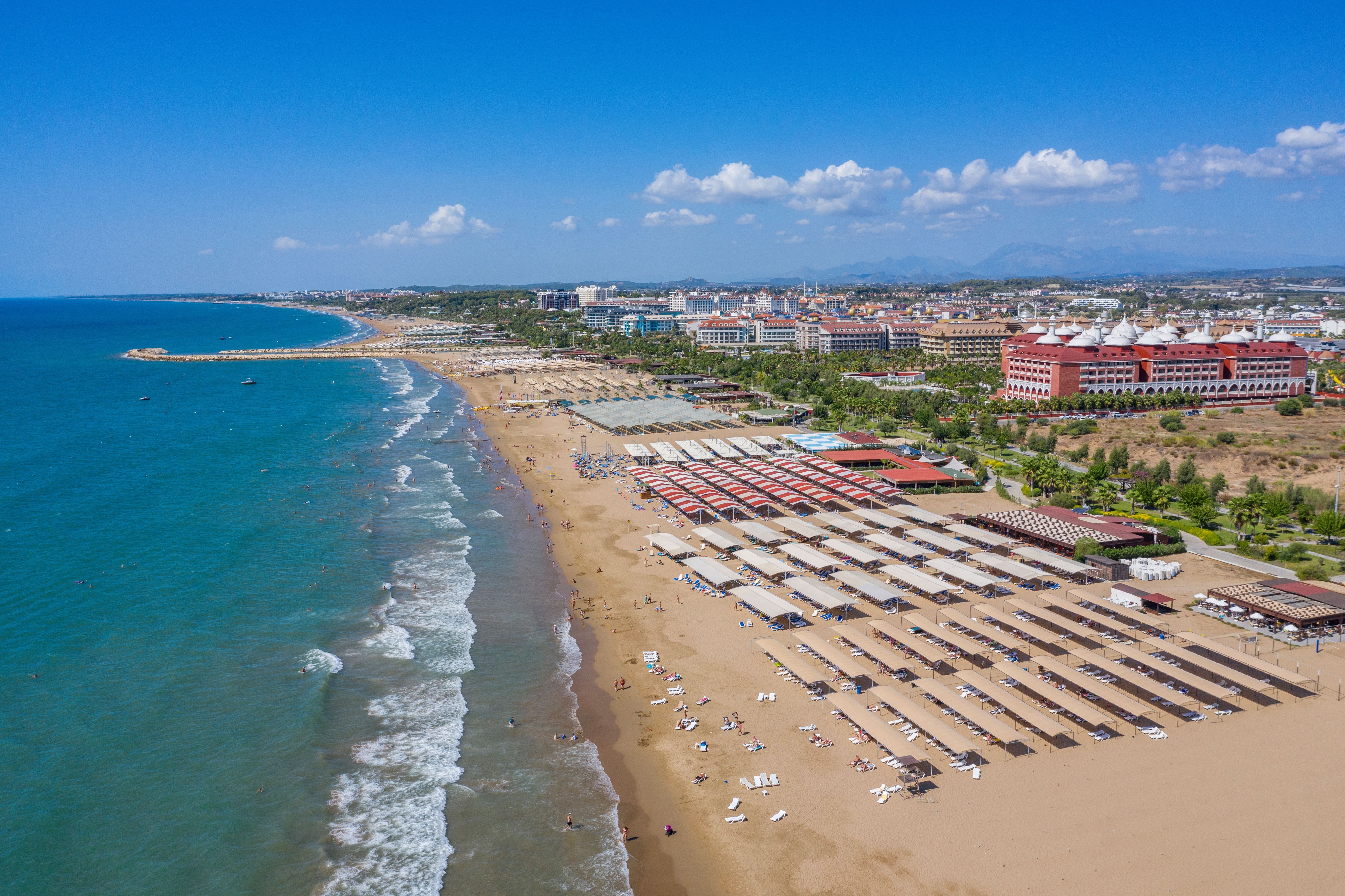 A vast sandy beach stretching along the coast in Side, Turkey