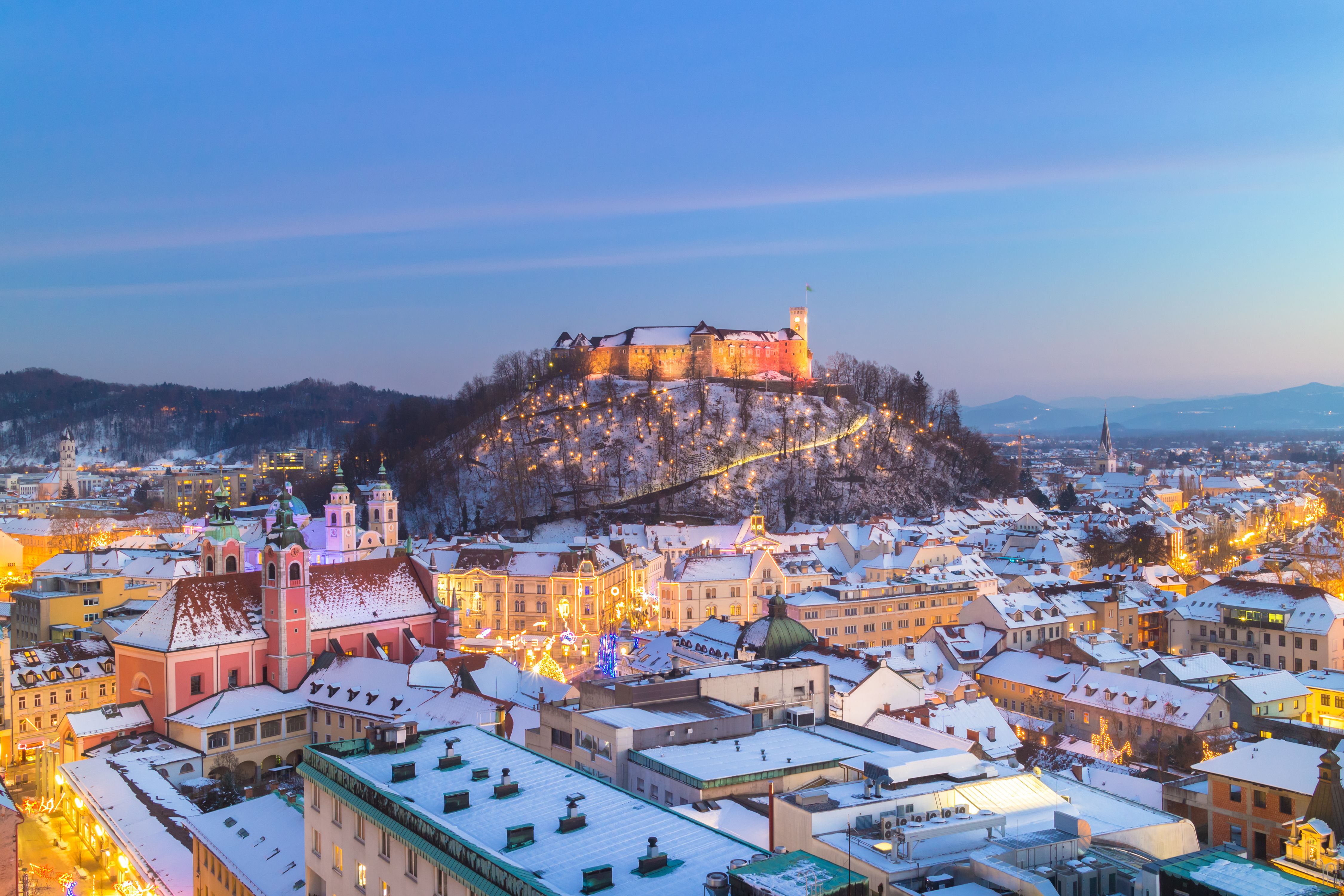 Aerial panoramic view of Ljubljana city centre decorated for Christmas with a dusting of snow