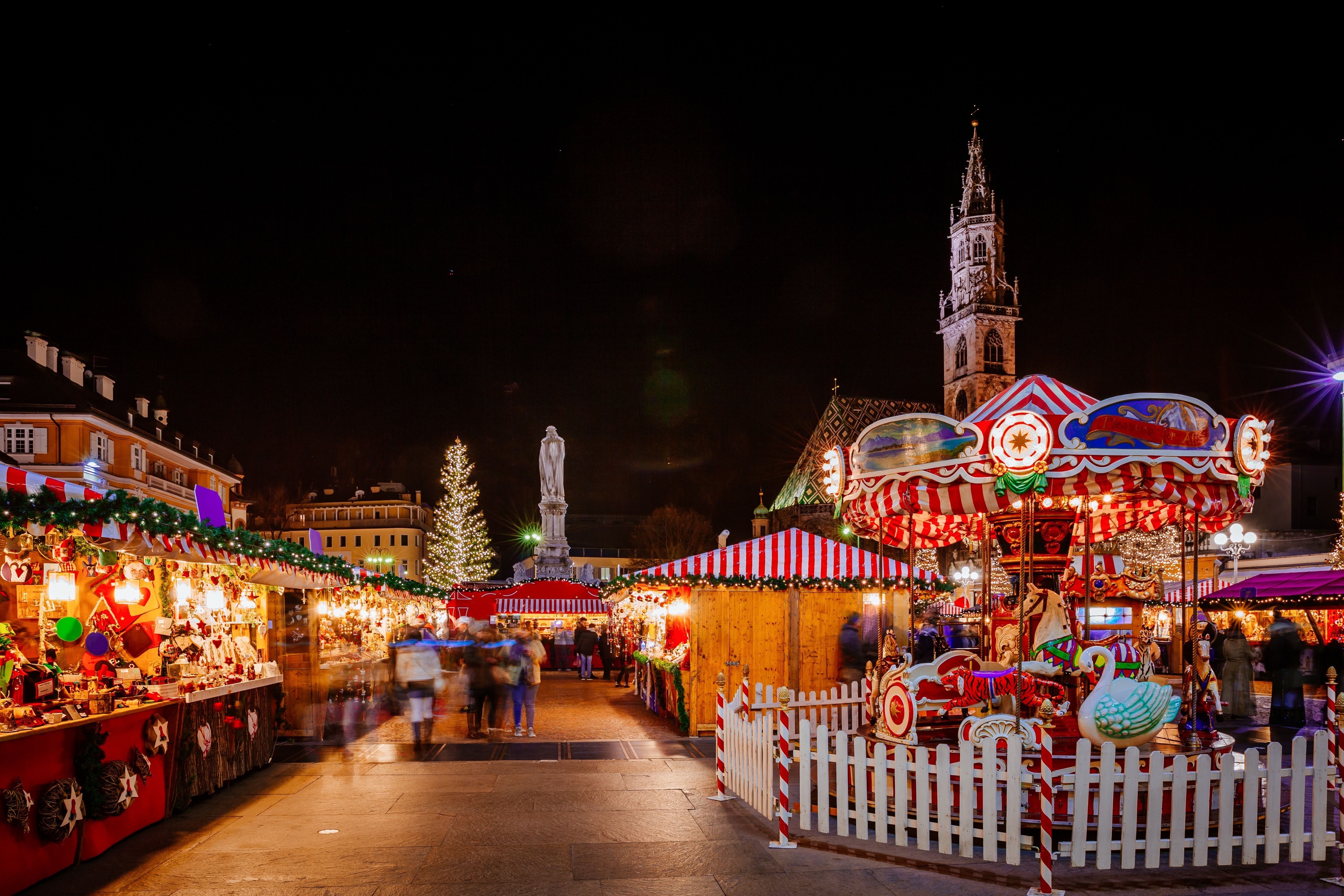 A view of Gothenburg Christmas Market in Sweden with brightly coloured stalls and fairground rides