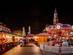 A view of Gothenburg Christmas Market in Sweden with brightly coloured stalls and fairground rides