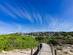 View of a beach walkway leading to Son Bou resort in Menorca, Balearic Islands