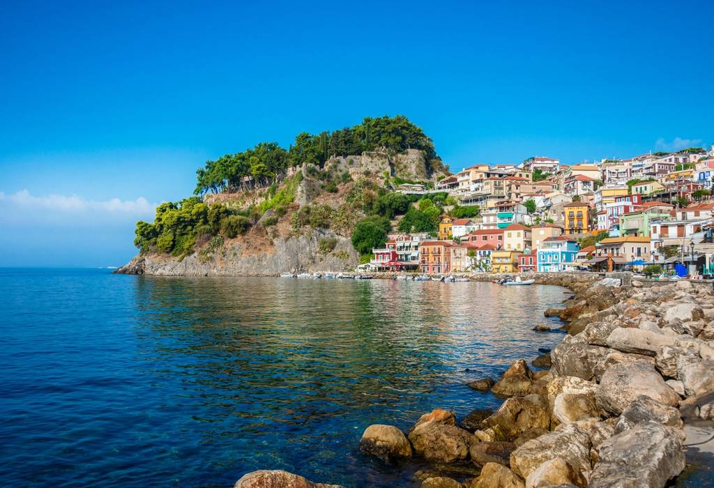 Panoramic View of Parga Harbour in Greece with colorful and traditional houses reflecting in the Mediterranean Sea