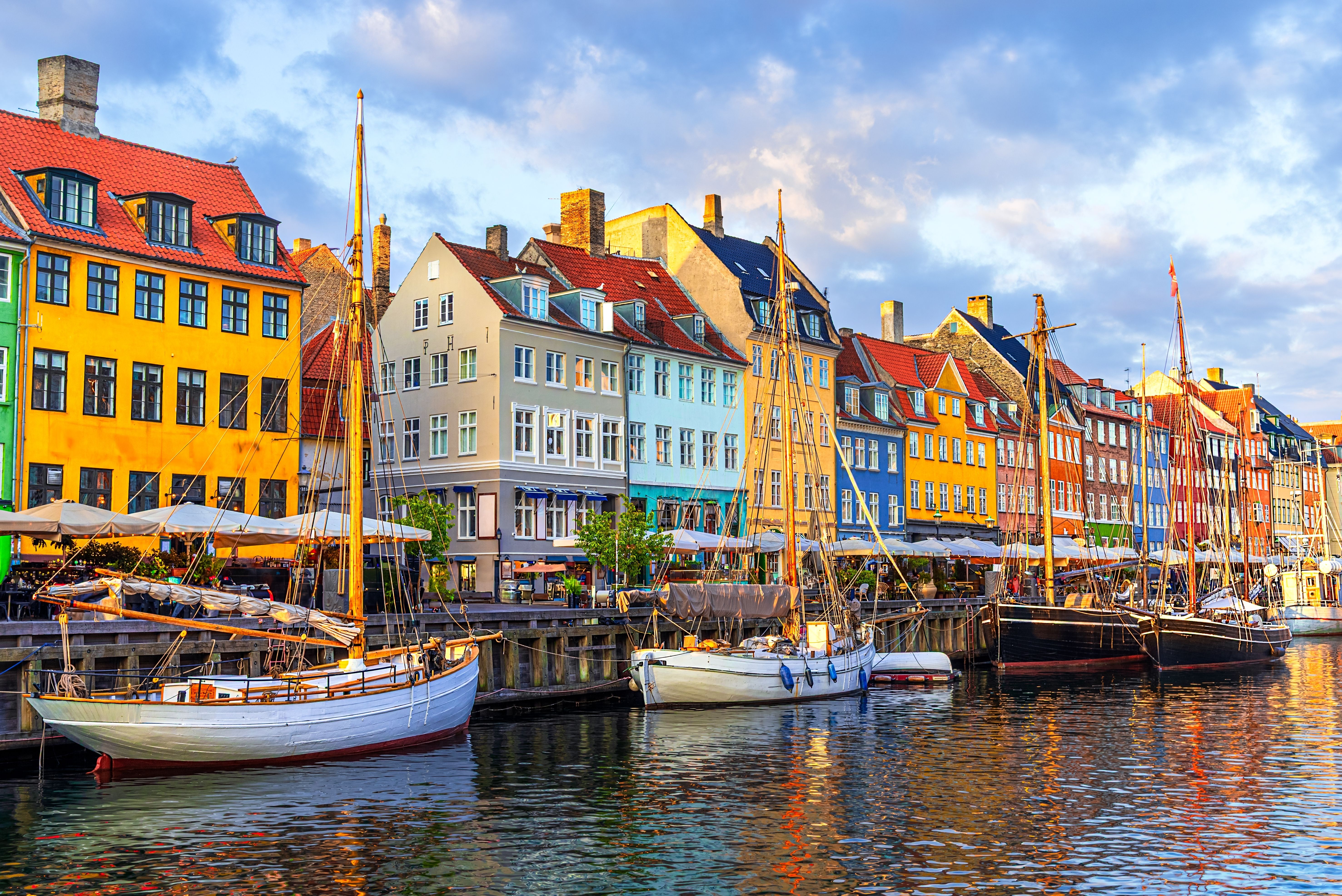 View of Nyhavn canal waterfront with colourful houses and sail boats in Copenhagen