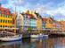 View of Nyhavn canal waterfront with colourful houses and sail boats in Copenhagen