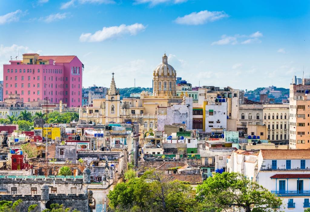 View of Havana's rooftops and a domed church on a sunny day