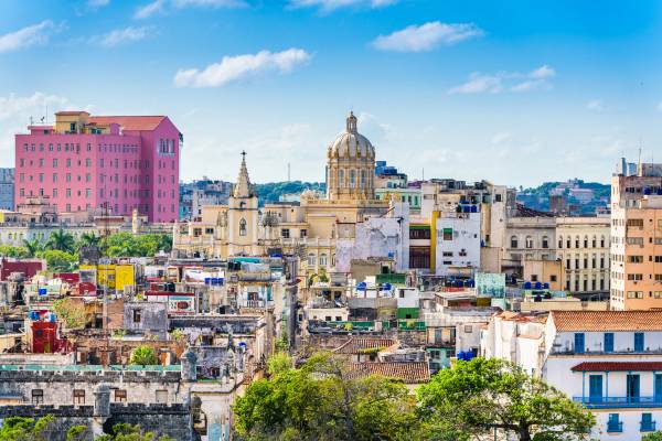 View of Havana's rooftops and a domed church on a sunny day