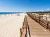 A wooden boardwalk leading to Monte Gordo beach in the Algarve