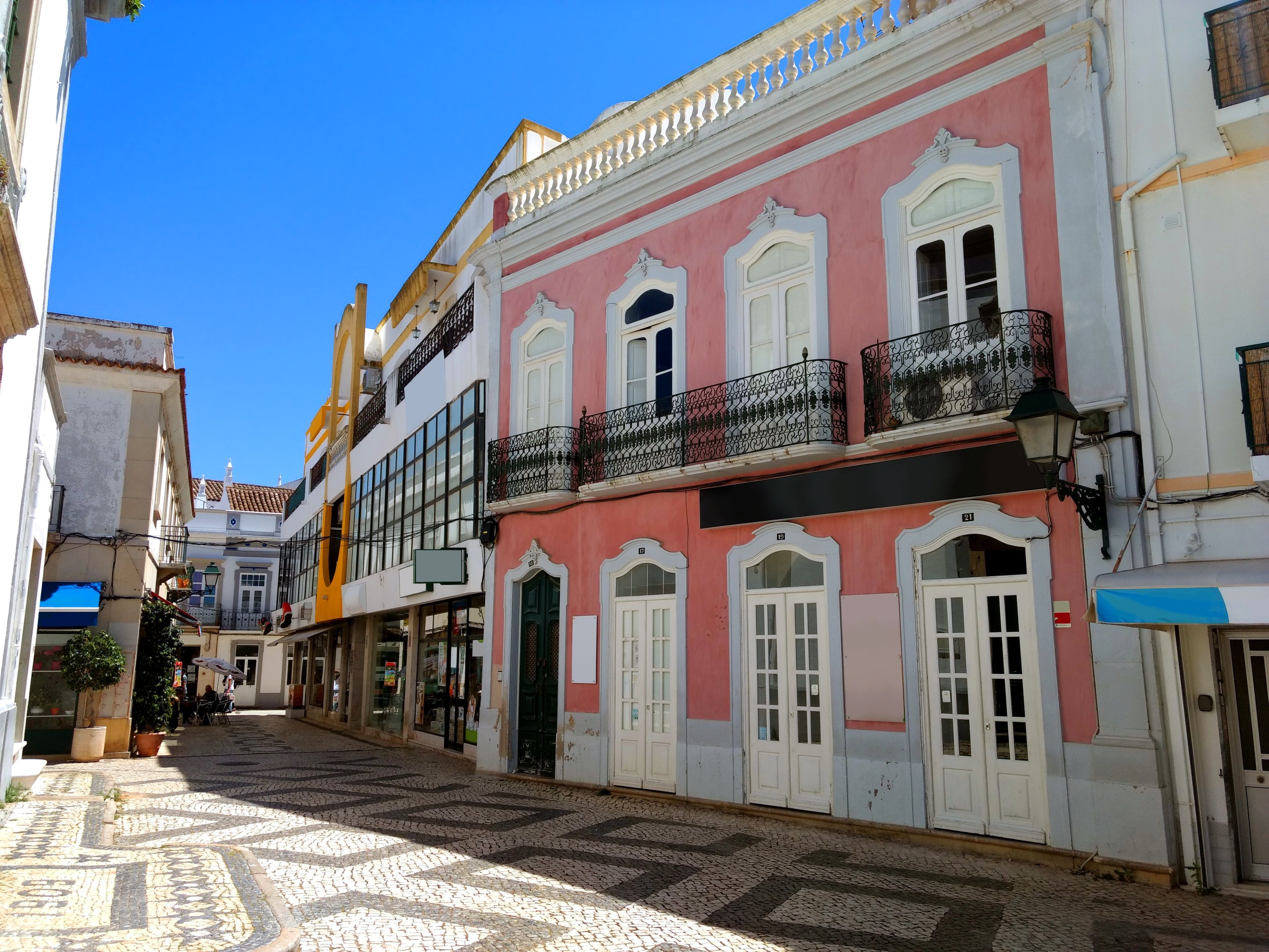 An old town street with colourful houses in Olhão, Portugal
