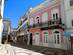 An old town street with colourful houses in Olhão, Portugal