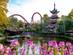 A view of a lake and rollercoaster ride in Tivoli gardens, Copenhagen