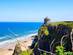 Overlooking the golden stand and temple-topped cliff of Downhill Strand, Northern Ireland