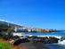A view across a black-sand beach of Puerto de la Cruz in Tenerife, Canary Islands
