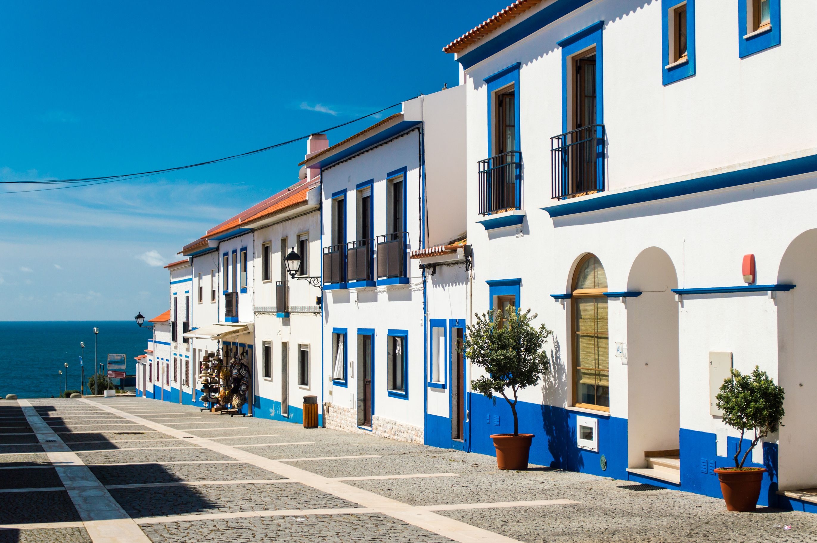 Traditional blue and white houses in Porto Covo, Portugal