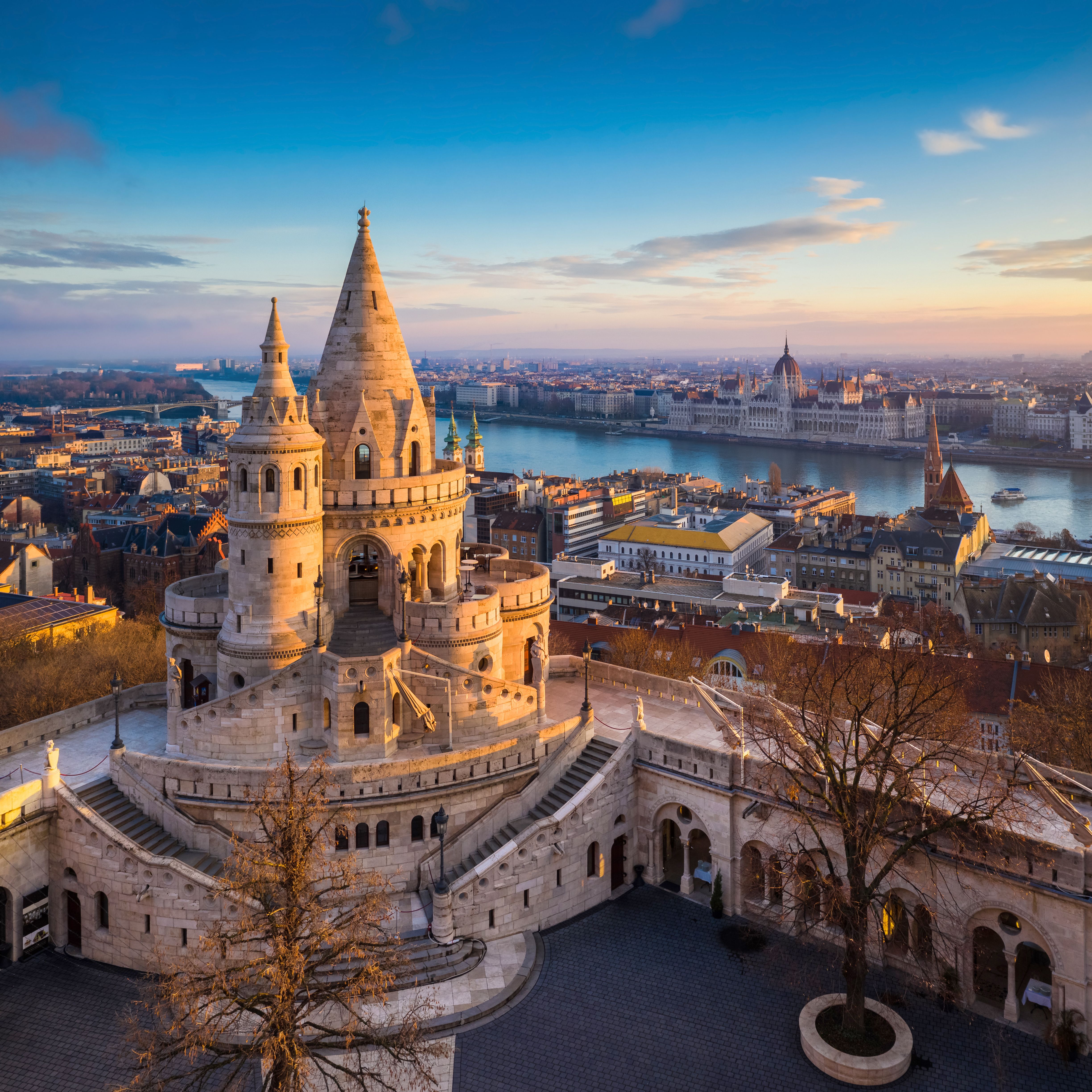 Aerial view over Fisherman's Bastion in Budapest on a winter's day with the Parliament building and River Danube in the background