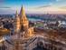 Aerial view over Fisherman's Bastion in Budapest on a winter's day with the Parliament building and River Danube in the background
