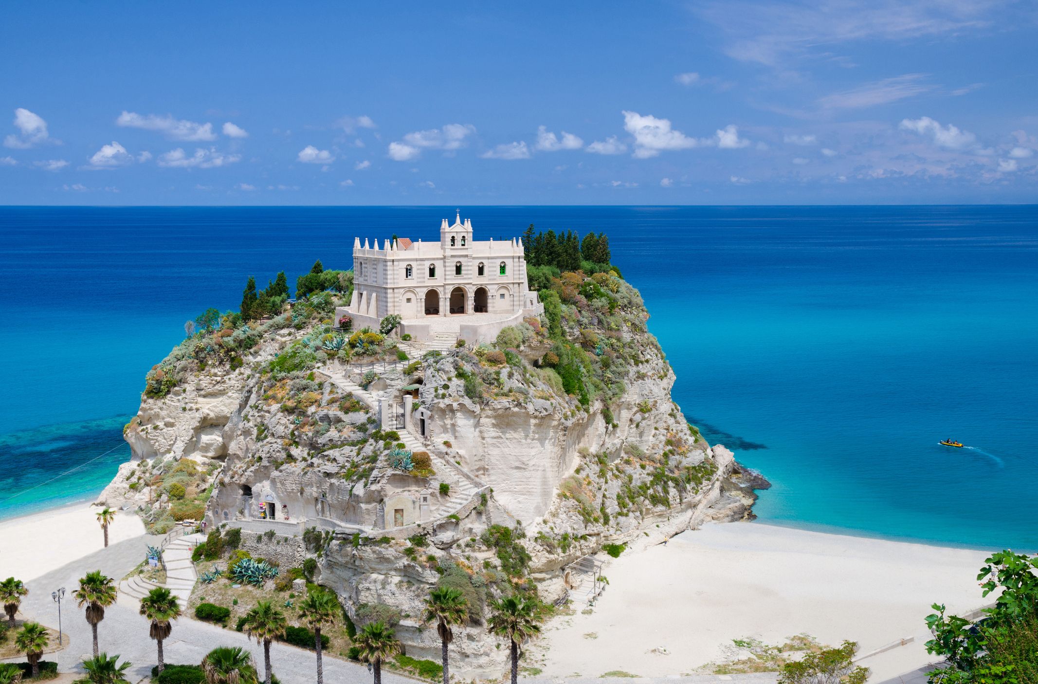 A view of the church of Santa Maria overlooking Tropea beach in Calabria, Italy