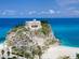 A view of the church of Santa Maria overlooking Tropea beach in Calabria, Italy