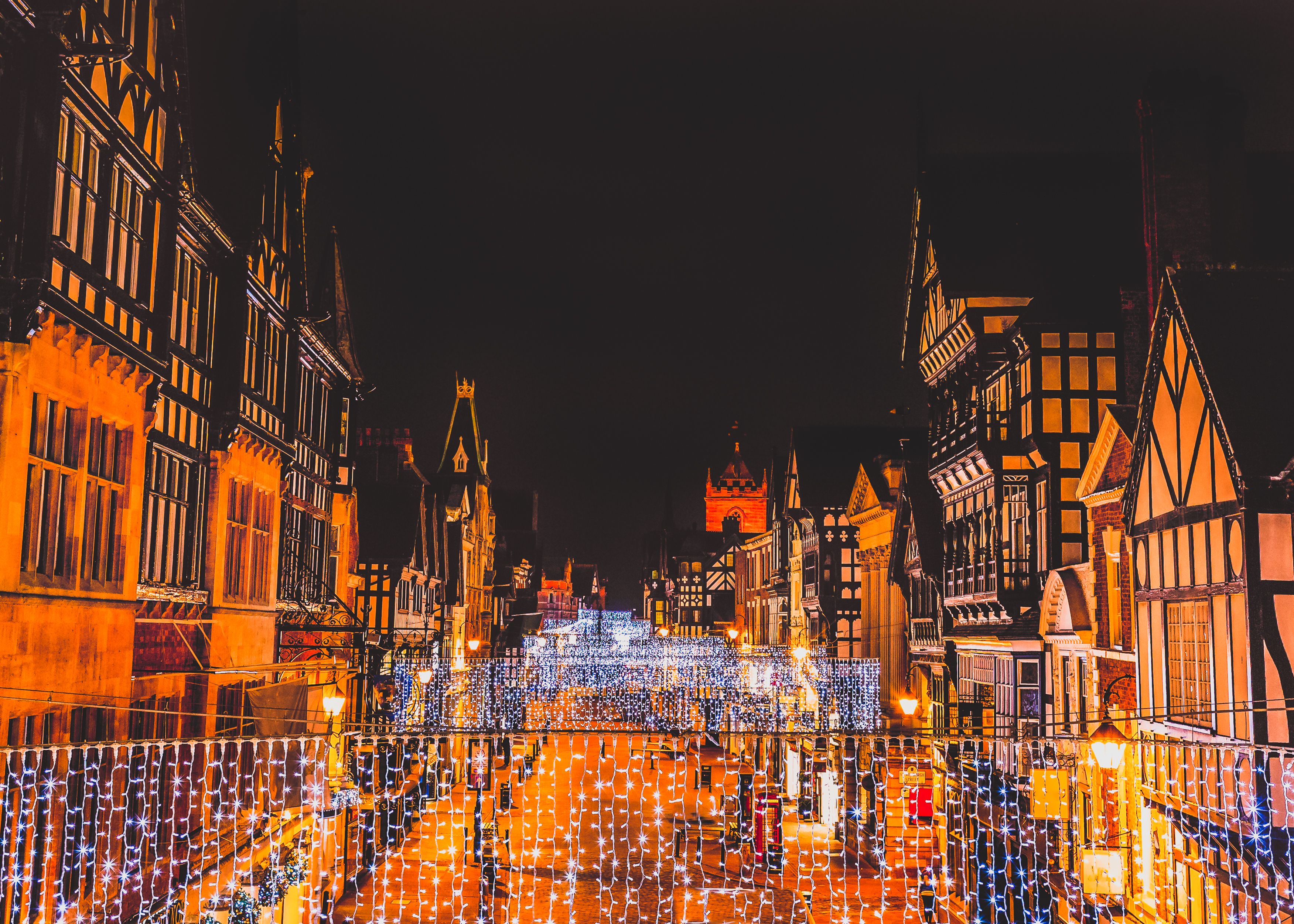 A view of the high street of Chester decked out in fairly lights at the Christmas market