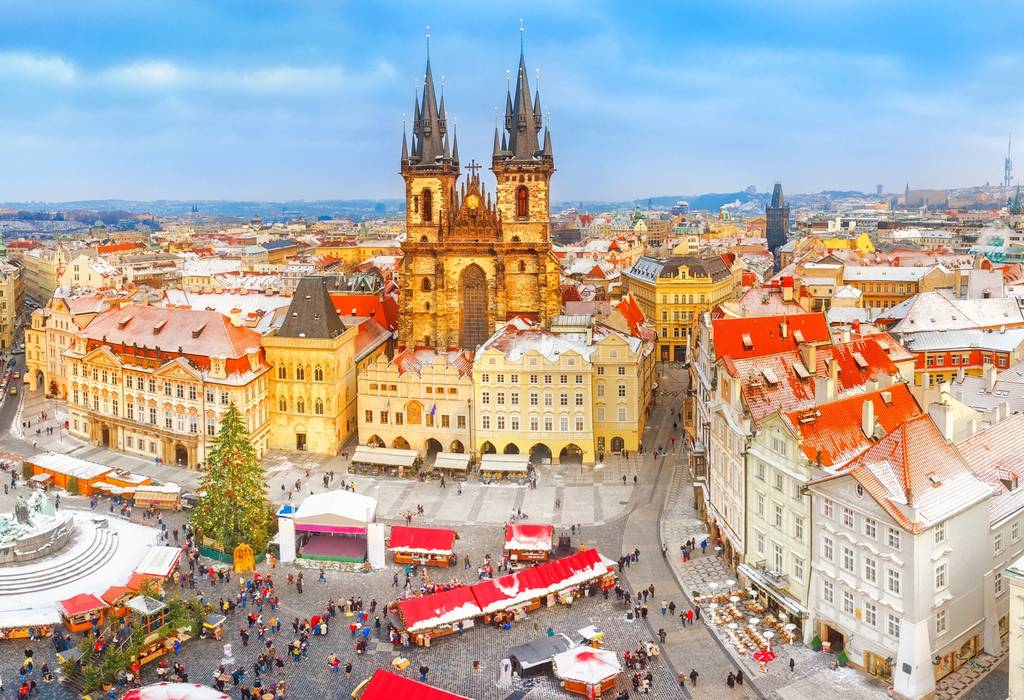 A panoramic view of Prague Old Town at Christmas with festive market stalls