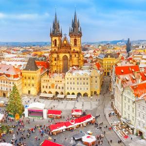 A panoramic view of Prague Old Town at Christmas with festive market stalls