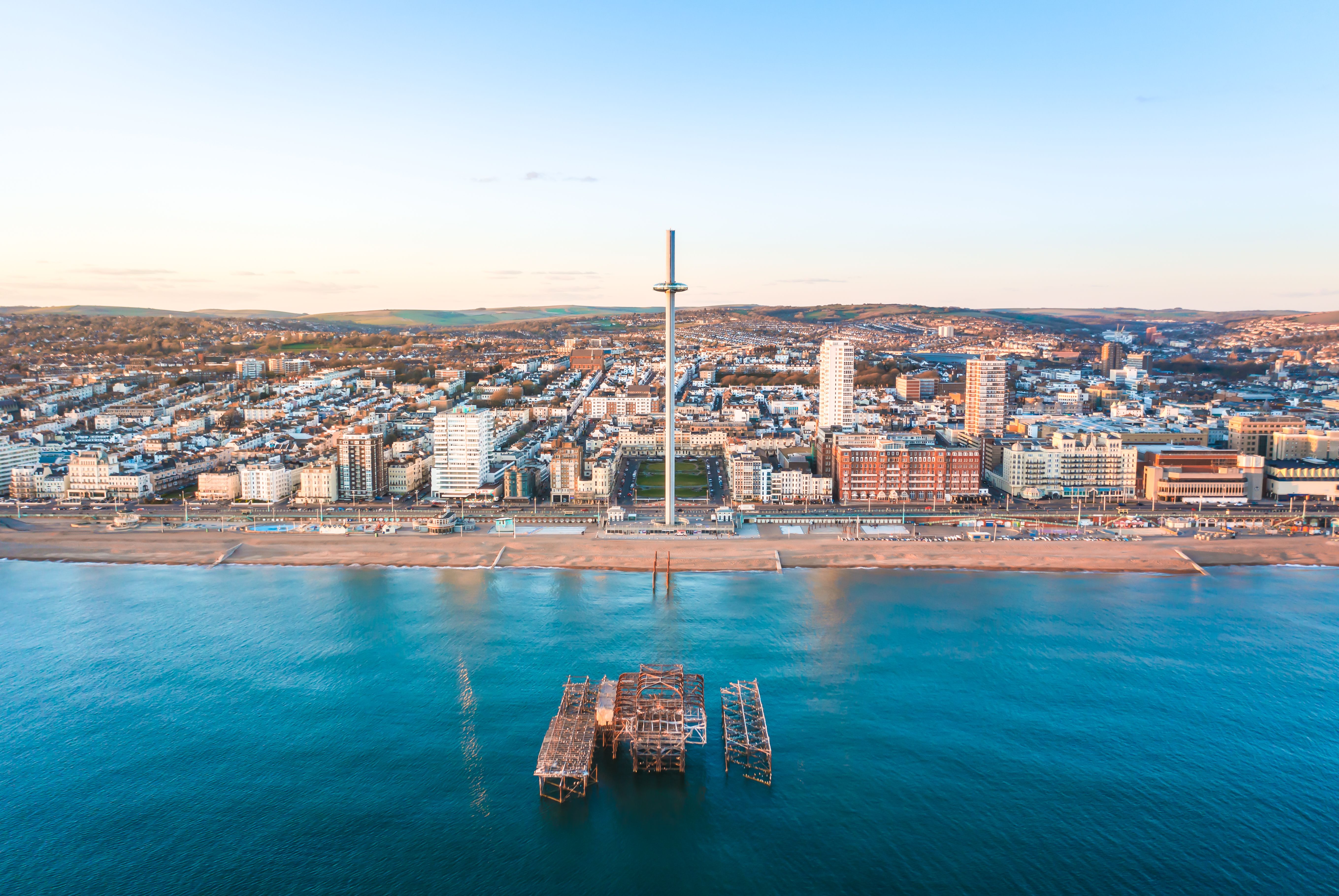 Aerial view from the beach towards the beach and pier at Brighton, England