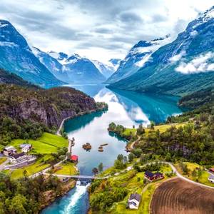 A view of the beautiful nature in Norway showing the natural landscape with snowy mountains and lake