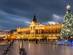Krakow Main Market square and Cloth Hall in winter, with Christmas markets and a Christmas tree.