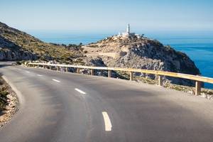 View of a curving road that leads to the famous lighthouse on the Formentor Peninsula on the Balearic Island of Majorca