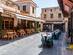 Restaurants in a courtyard in Rhodes Old Town, Greece