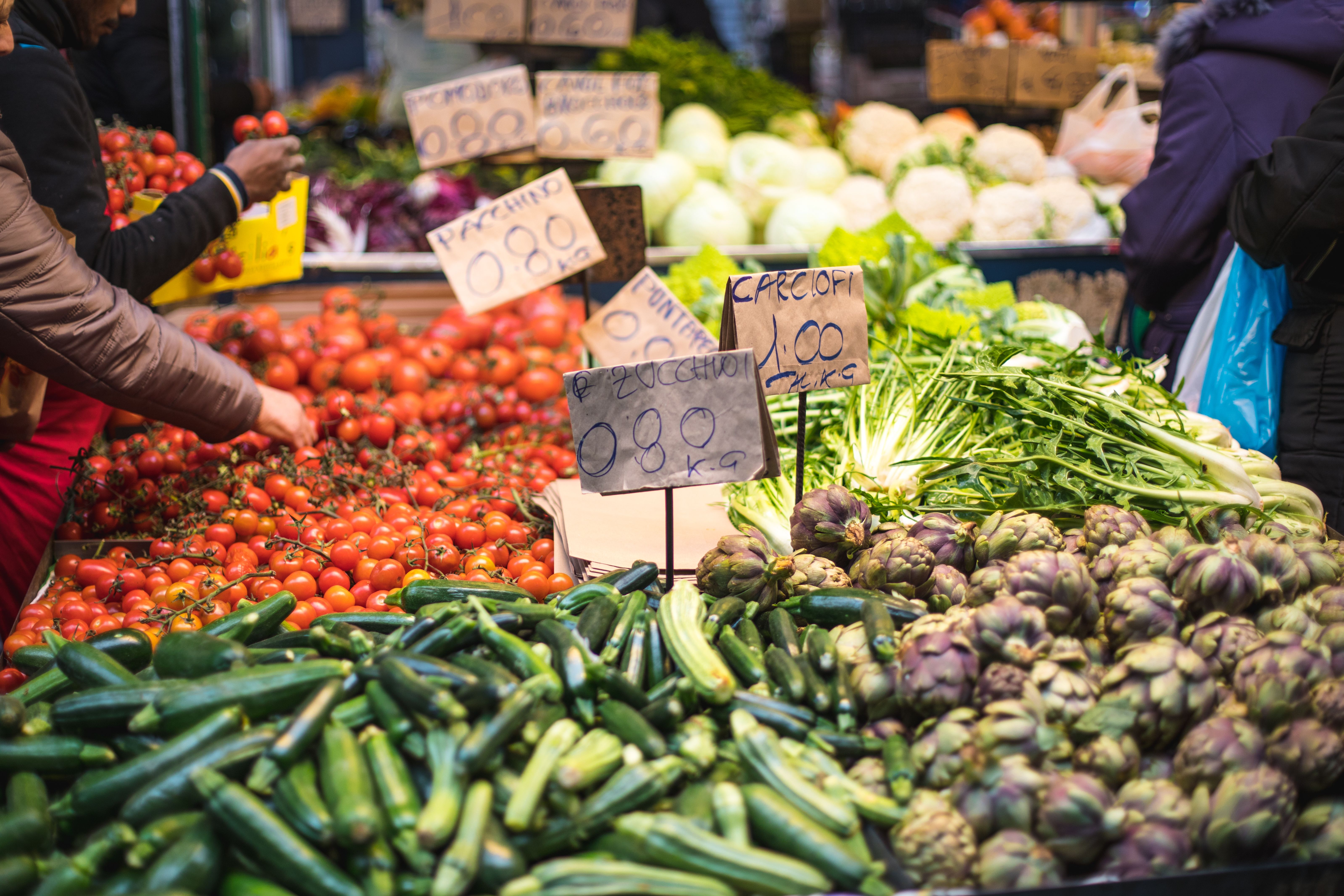 Street market with zucchinis, artichokes, tomatoes and other vegetables in Rome, Italy