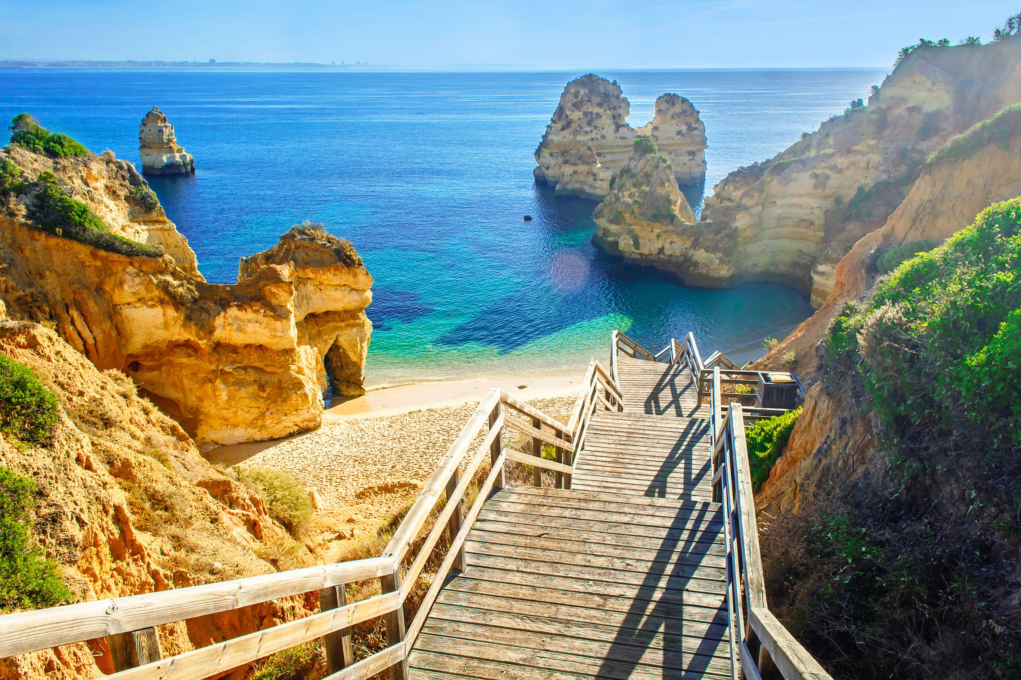 Wooden footbridge leading to Praia do Camilo beach near Lagos in the  Algarve region of Portugal
