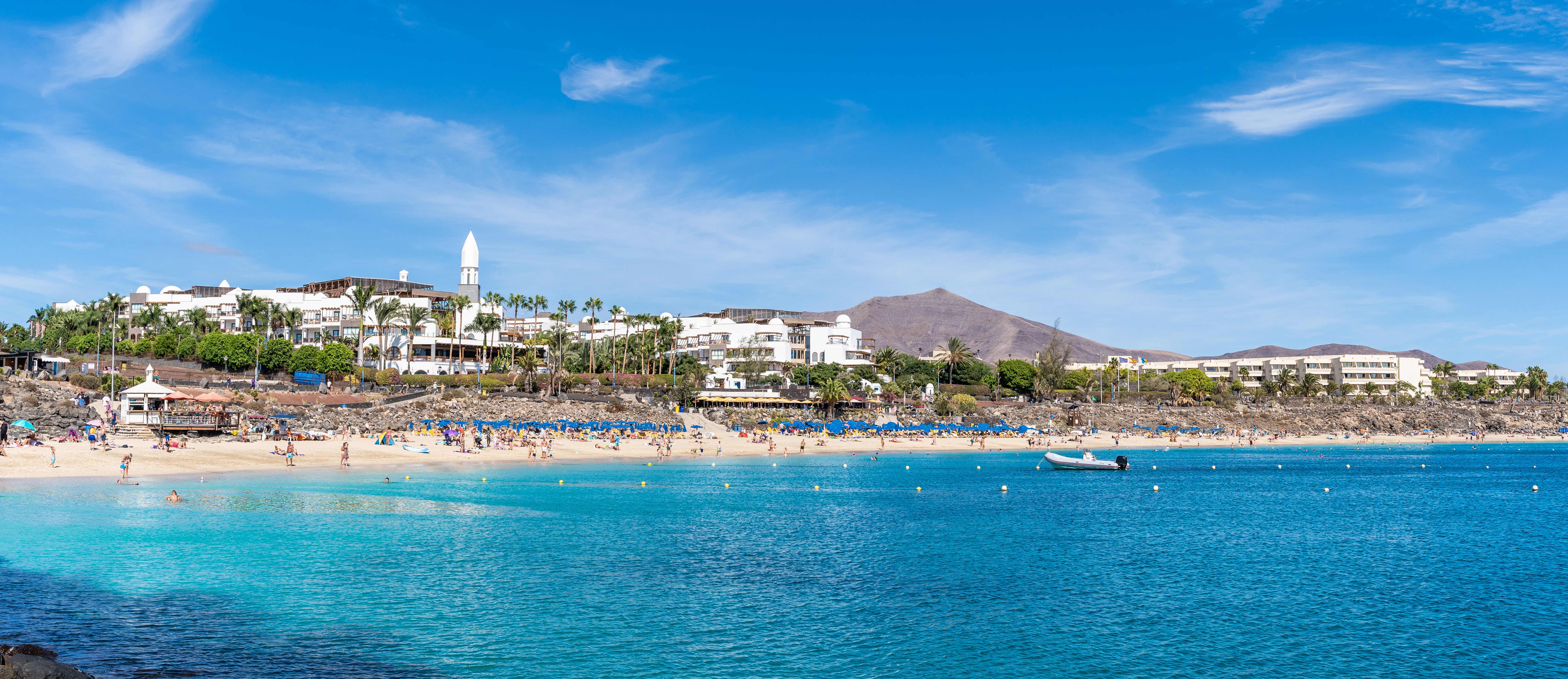 A view across the sea of Playa Blanca beach in Lanzarote, Canary Islands
