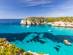 A view across the headlands of Macarella beach on the coast of Menorca, Balearic Islands