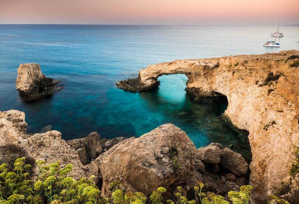 A beautiful natural rock arch formed in the blue Mediterranean sea in Ayia Napa on Cyprus island
