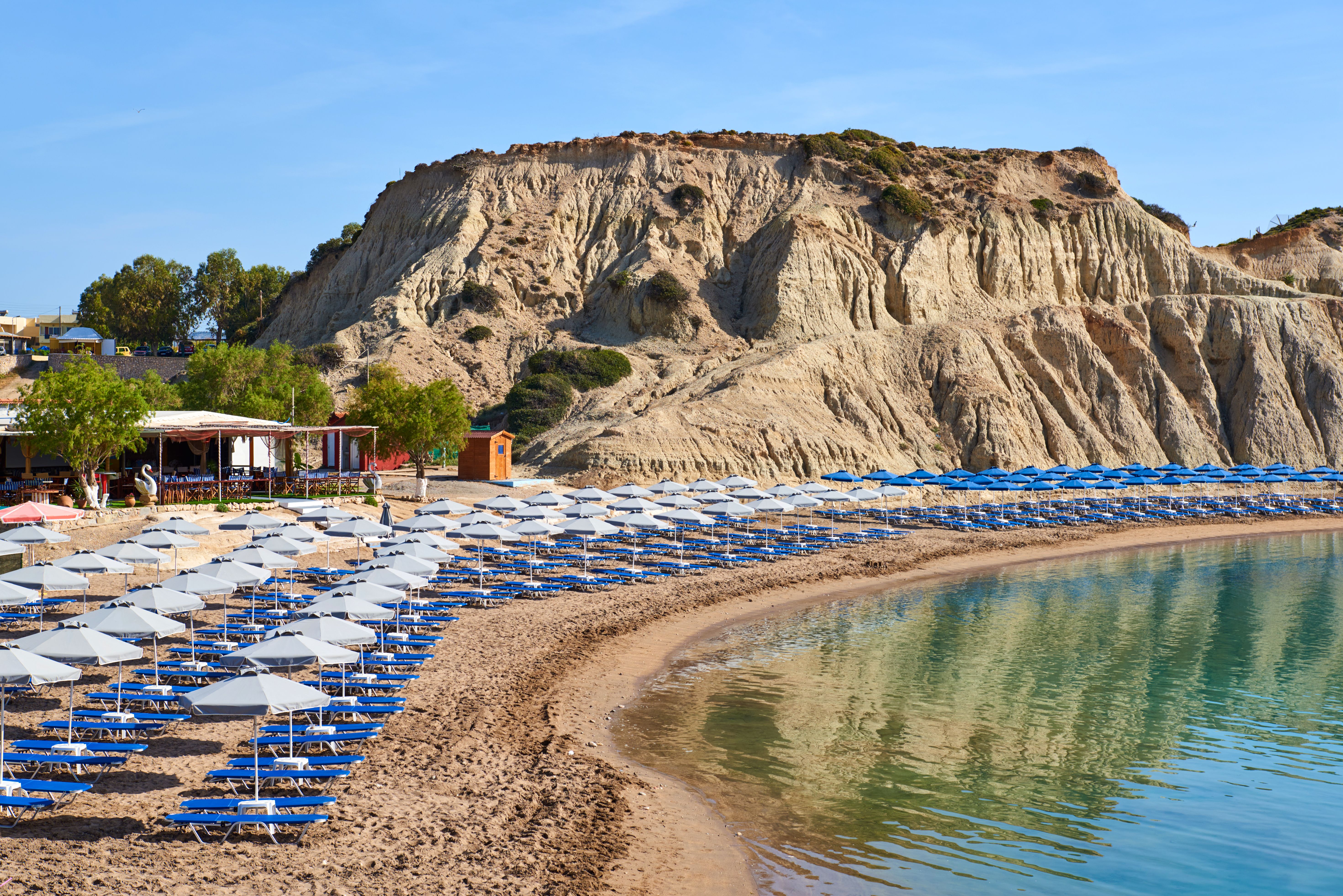 A view of Kolymbia beach lined by sun loungers in Rhodes